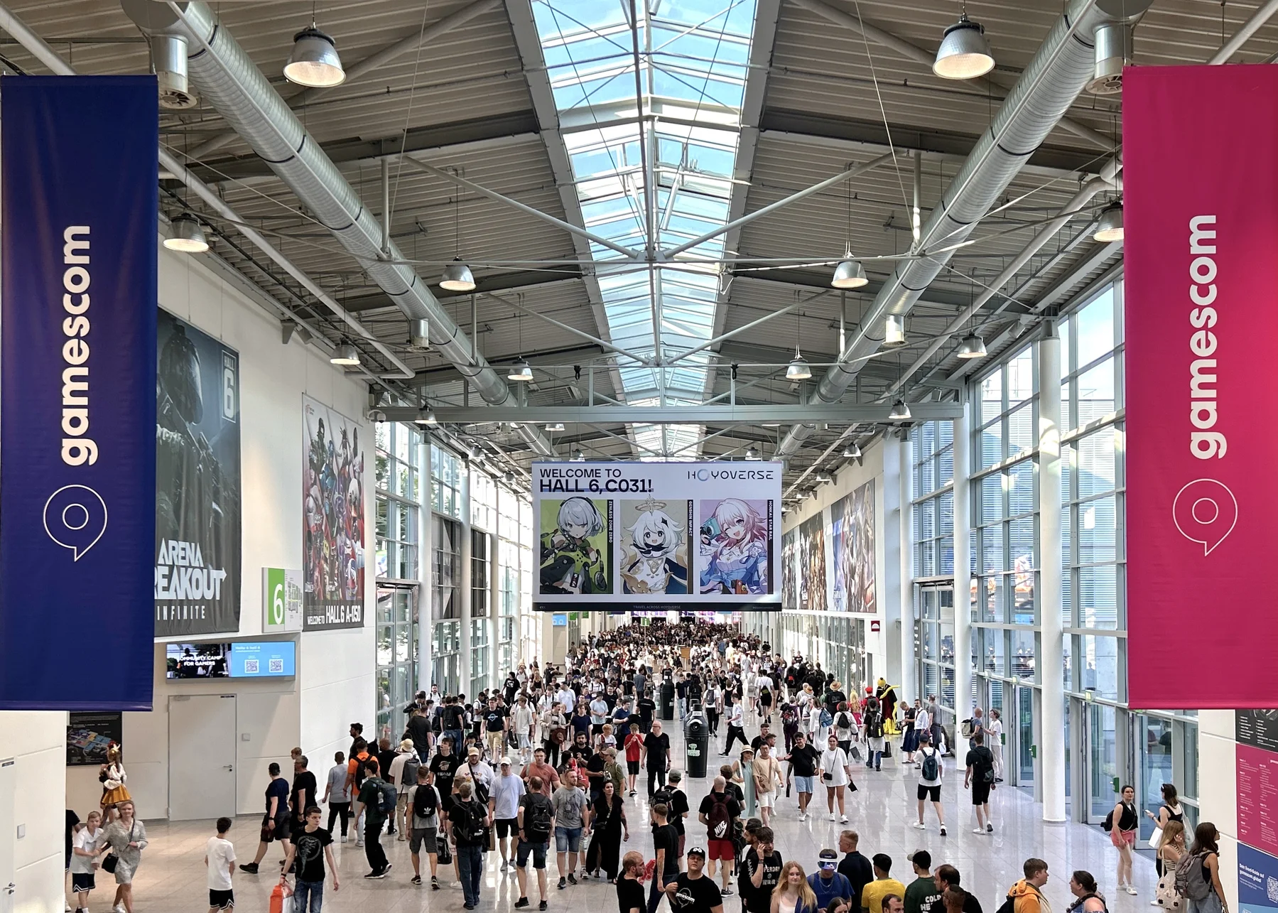 gamescom exhibition hall interior at Koelnmesse in Cologne with Hoyoverse and Arena Breakout booths