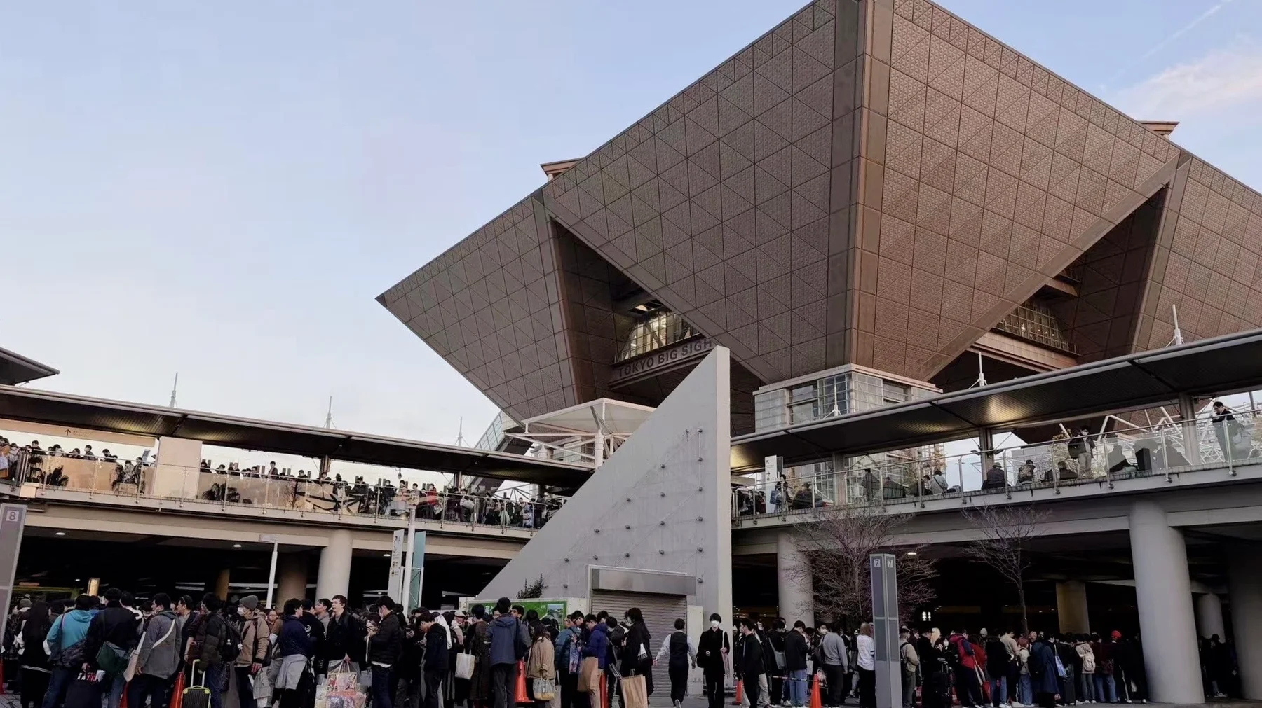 Tokyo Big Sight convention center exterior with crowd of attendees waiting outside